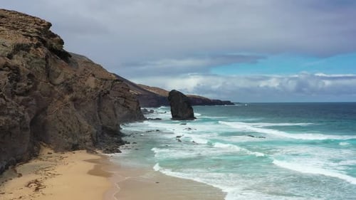 Aerial view of Cofete Beach with Roque del Moro on a cloudy day, Fuerteventura