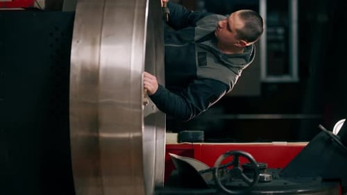 Vertical Video Coffee Holder in a Roasting Factory Checking the Roast Level of the Coffee Ready to
