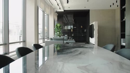 Contemporary Kitchen Interior Featuring an Elegant Marble Dining Table and Spacious Layout Design