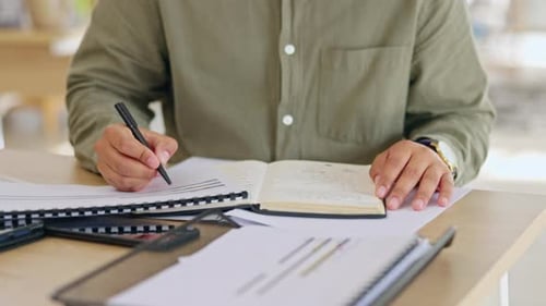 Writing, notebook and documents with hands of man in office for strategy