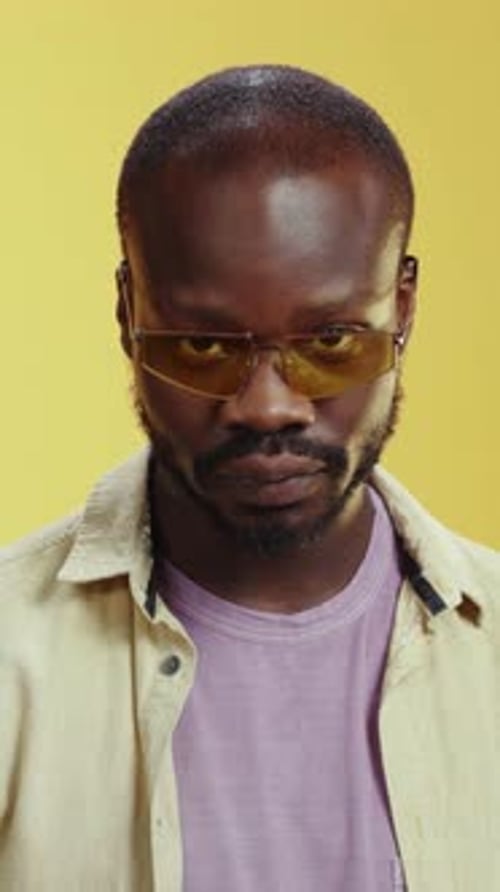 Cheerful Man Laughs and Points at the Camera