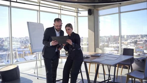 Happy business colleagues in modern office. Brainstorming at the office.