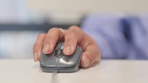Close up of Female Hand Using Computer Mouse