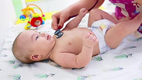 Infant Examined with Stethoscope at Doctor's Office