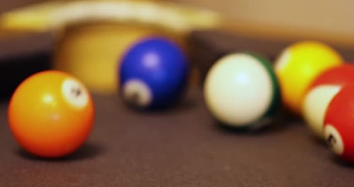 Colored Striped Ball Hit By A Player On Corner Pocket On Billiard Game. Selective Focus