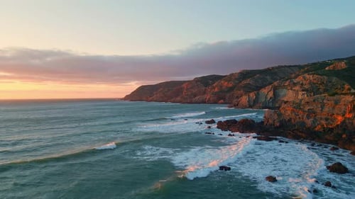 Breathtaking Cliffside Coastline at Sunset Ocean Waves and Golden Light