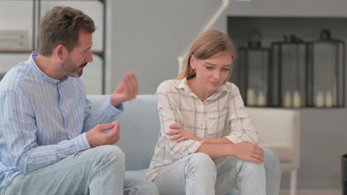 Couple Disagreement: Upset Woman and Talking Man
