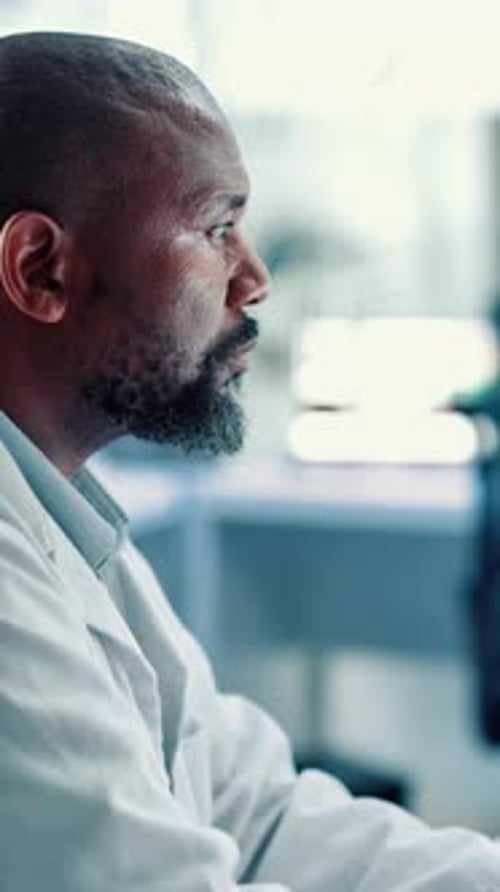 Man in Lab Coat Working in Laboratory