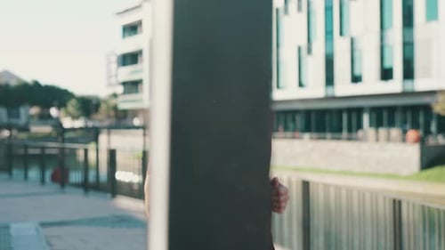 Young Adult Runs in Urban Environment