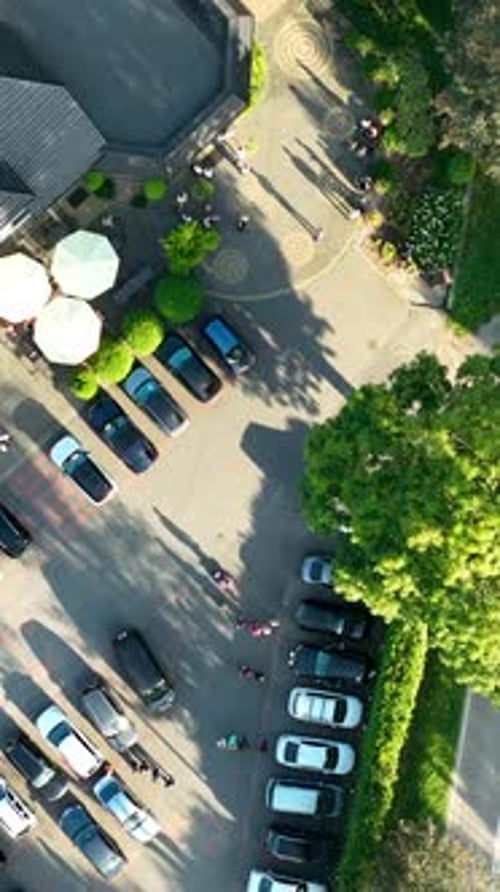 Top Down Aerial View Of Resort Parking Lot And Garden Path