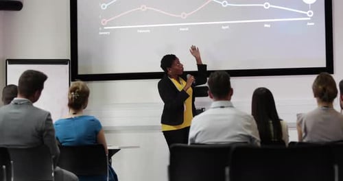 Female executive leading a training conference