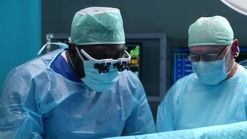Team of Professional Medical Surgeons Performs the Surgical Operation in a Modern Hospital Doctors