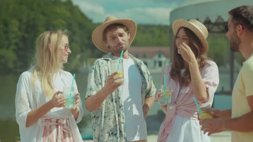 Friends Enjoying Refreshments and Toasting on a Summer Day