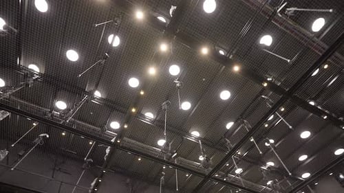 Entering Empty Theater Hall with a view on Tension Wire Grid Ceiling