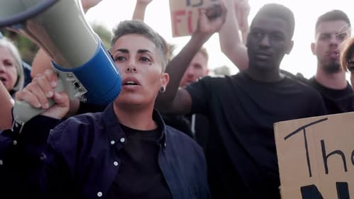 Crowd of People Protesting and Speaking to Megaphone