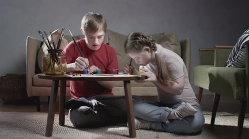 Two Children Doing Arts and Crafts at Home