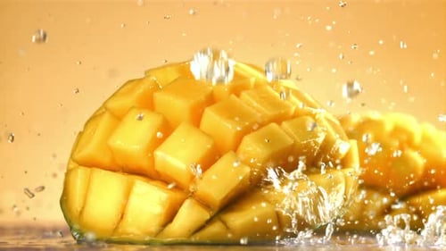 Raindrops Fall on Fresh Mango Filmed on a Highspeed Camera at 1000 Fps