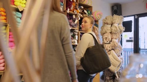 Alberta yarn store owner helps customer with choices and shopping in calgary Canada