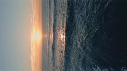 Idyllic Sea Sunset Shining in Deep Blue Ocean Water Aerial View Waves Foaming