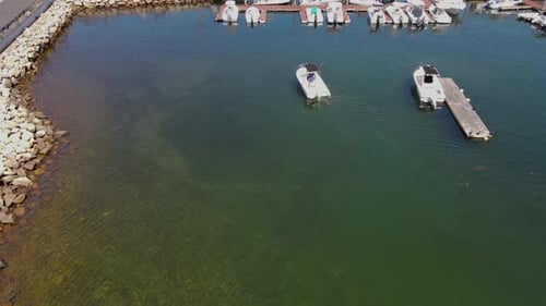 Boat Driving Through Marina Aerial View