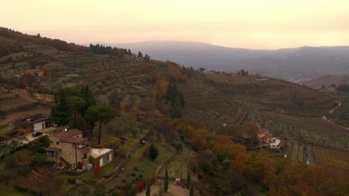 Tuscany Italy aerial view of rolling hills vineyards and forests on an overcast day