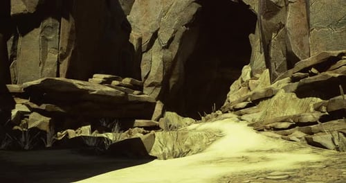 Rocky Canyon Landscape Featuring Sandy Path and Towering Cliffs During Daylight