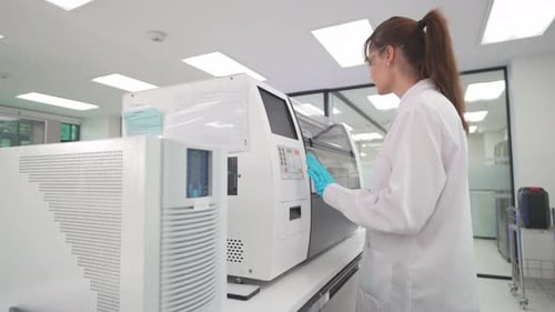 Young Woman Working in Bright Scientific Laboratory