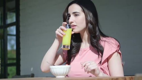 MS TU Young woman drinking juice / Breda, Noord-Brabant, Netherlands