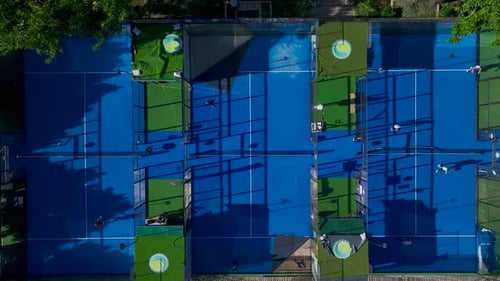 Aerial View Trainers and Players Practice Paddle Tennis on Highquality Courts with Breathtaking