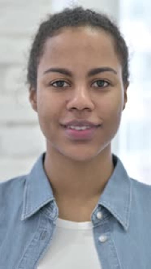 Smiling Young Woman in Denim Jacket, Portrait