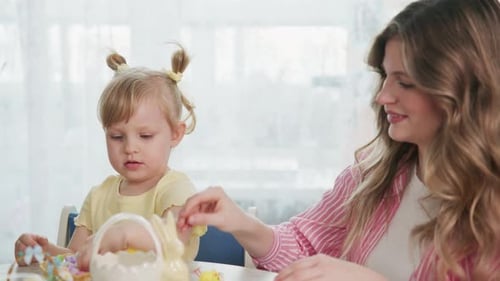 Mom and Toddler Decorate Easter Eggs with Care and Smiles