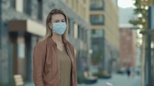 Woman Wearing Face Mask in Urban Environment