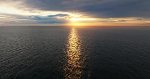 Sunset's Reflections Across The Vast Sea