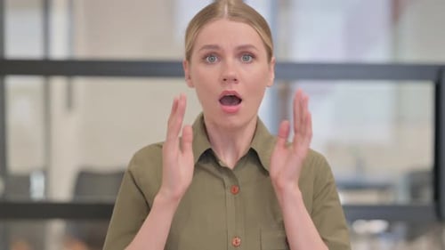 Young Woman Reacts to Something Shocking, Mid Shot