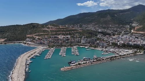 General view of the harbor on the city coast on a partly cloudy day with drone