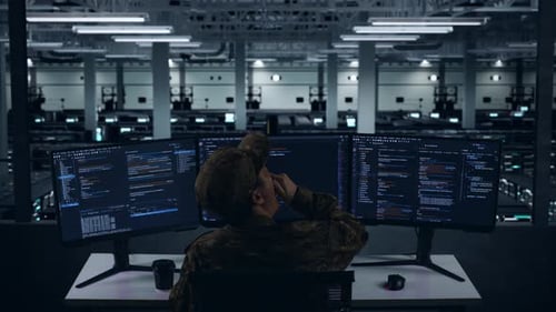 Tired Asian Military Yawning Before Sleeping While Write Code In Data Center