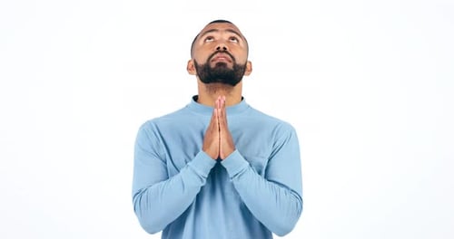 Hands, man and praying in studio with anxiety for news, results or lottery