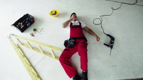 Top View of an Injured Man Lying on the Floor After An