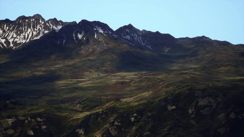 A Breathtaking Panoramic View of Majestic Mountain Peaks in the Distance