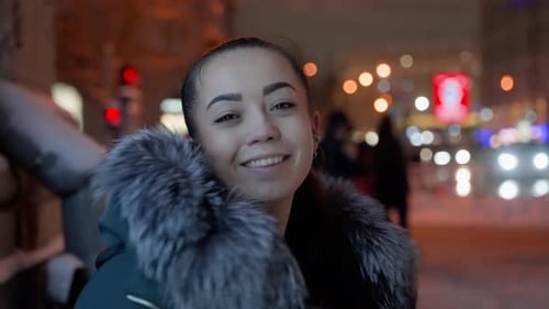 Young Woman in City Night Lights