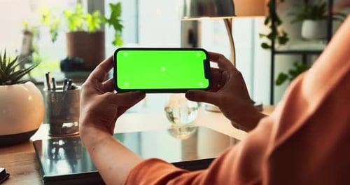 Smartphone, hands and green screen for communication, mockup space and branding as ux
