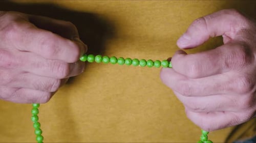 Man Holding Rosary In Hand 3