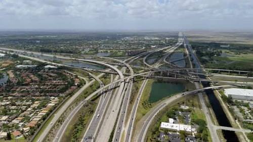 Elevated Freeway Intersection in Miami City with Fast Moving Cars USA Transportation Infrastructure