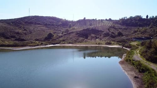 Aerial above lake Golemit and agricultural fields in Durres provence, Albania. hill landscape.