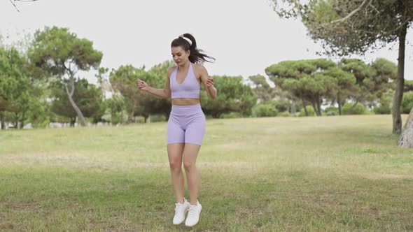 Athletic Woman Jumps Rope for Exercise in Park, Sports Stock Footage ft ...