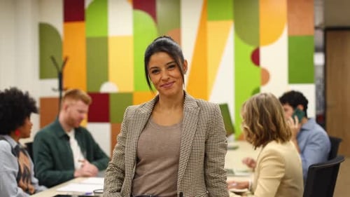Successful Confident Businesswoman Smiling in Modern Office Meeting