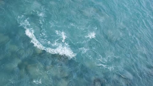 Aerial View of Bright Blue Ocean Waves