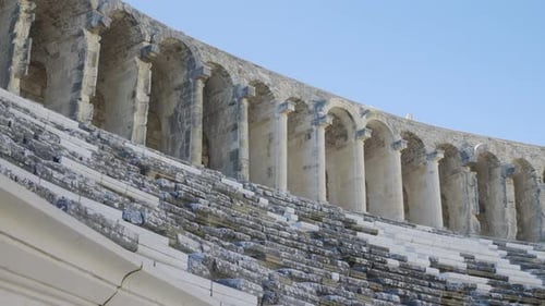 The Camera Moves Along the Steps of the Seats of the Ancient Amphitheater