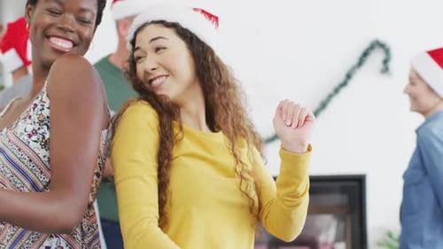 Friends Dancing at Christmas Party Celebration