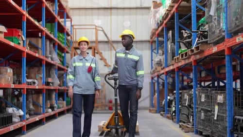 Warehouse Industrial and Logistics Companies. Dispatcher in uniform making inventory in storehouse.